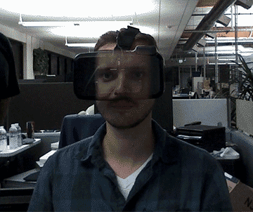A face is superimposed on a VR headset making it look transparent